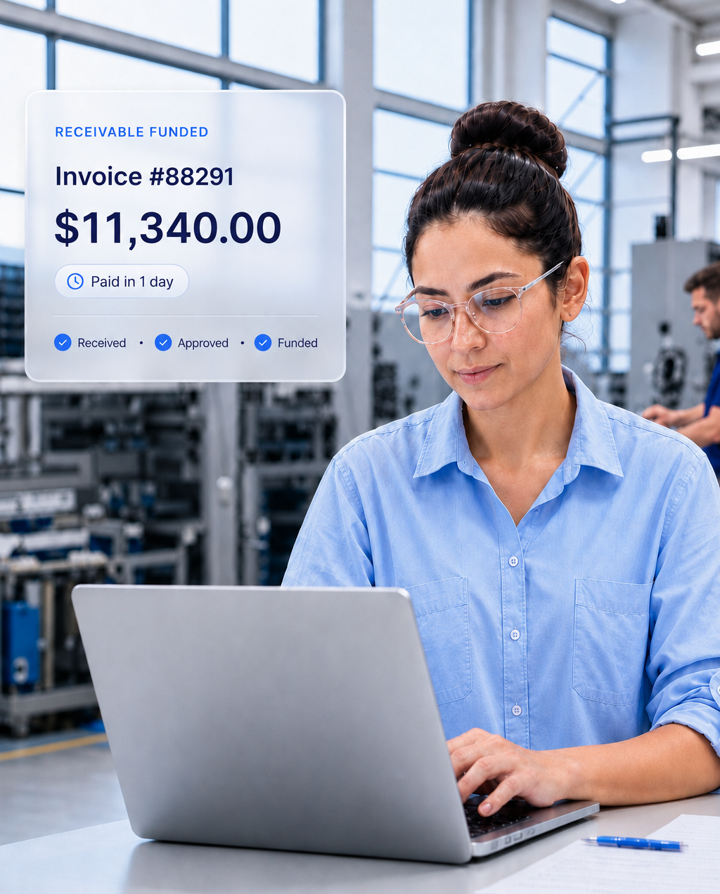 Manufacturing business owner reviewing funded invoice and working capital information on a laptop